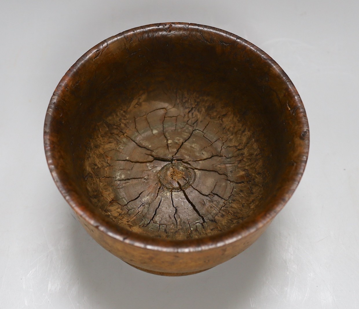 A turned burr maple bowl on pedestal base, 17cms diameter